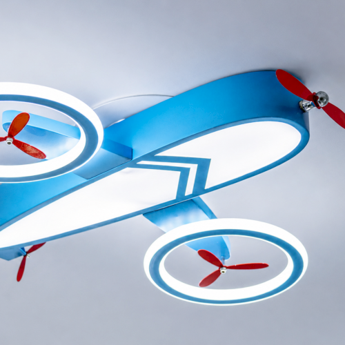 A blue toy-like airplane with round windows, bright lights, and red propellers in a playful sci‑fi style.